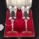 A cased pair of silver sherry goblets, hallmarked Sheffield 1973 by AT Cannon Ltd,