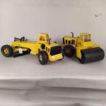 A large Tonka road grader plus a road roller