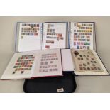 Four stamp albums, part filled with Indian stamps, definitives and postage due,