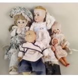 A large selection of porcelain headed collectors dolls