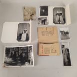 A selection of vintage postcards plus a box of early photographs