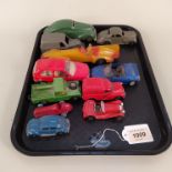 A selection of vintage racing cars and vehicles including a Timpo Toys mechanical, Dinky Studebaker,