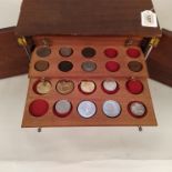 A mahogany twelve drawer coin collectors cabinet with mixed coin contents including milled silver