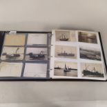 A large album of vintage postcards,