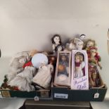 A large selection of vintage porcelain head dolls, some boxed,