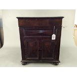 A vintage wood lidded gramophone music cabinet with two small doors