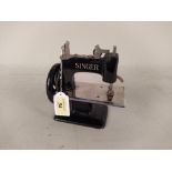 A miniature size childs Singer sewing machine,