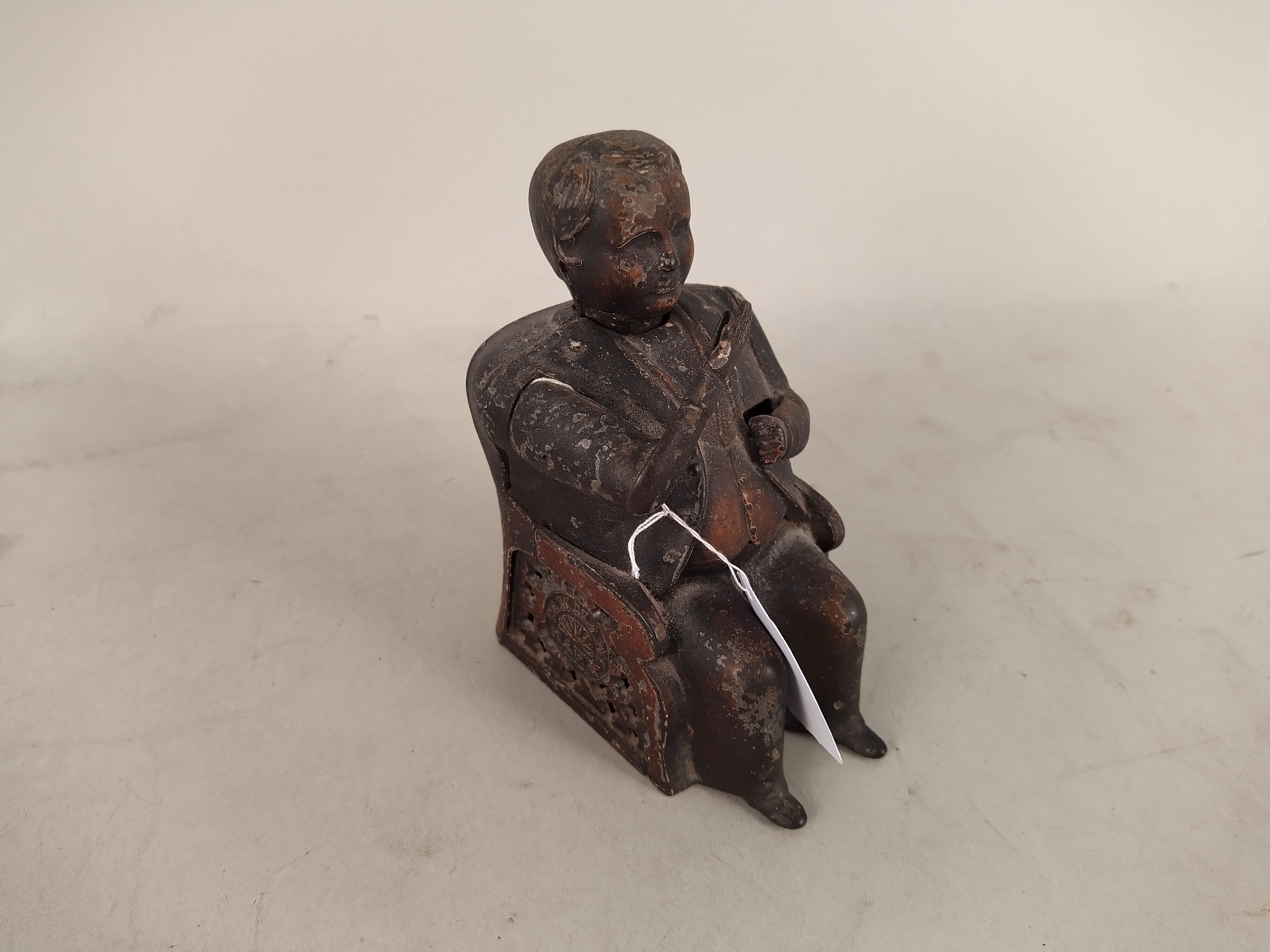 An American painted metal 'Tammany Bank' seated figure money box plus an eight string musical - Image 3 of 3