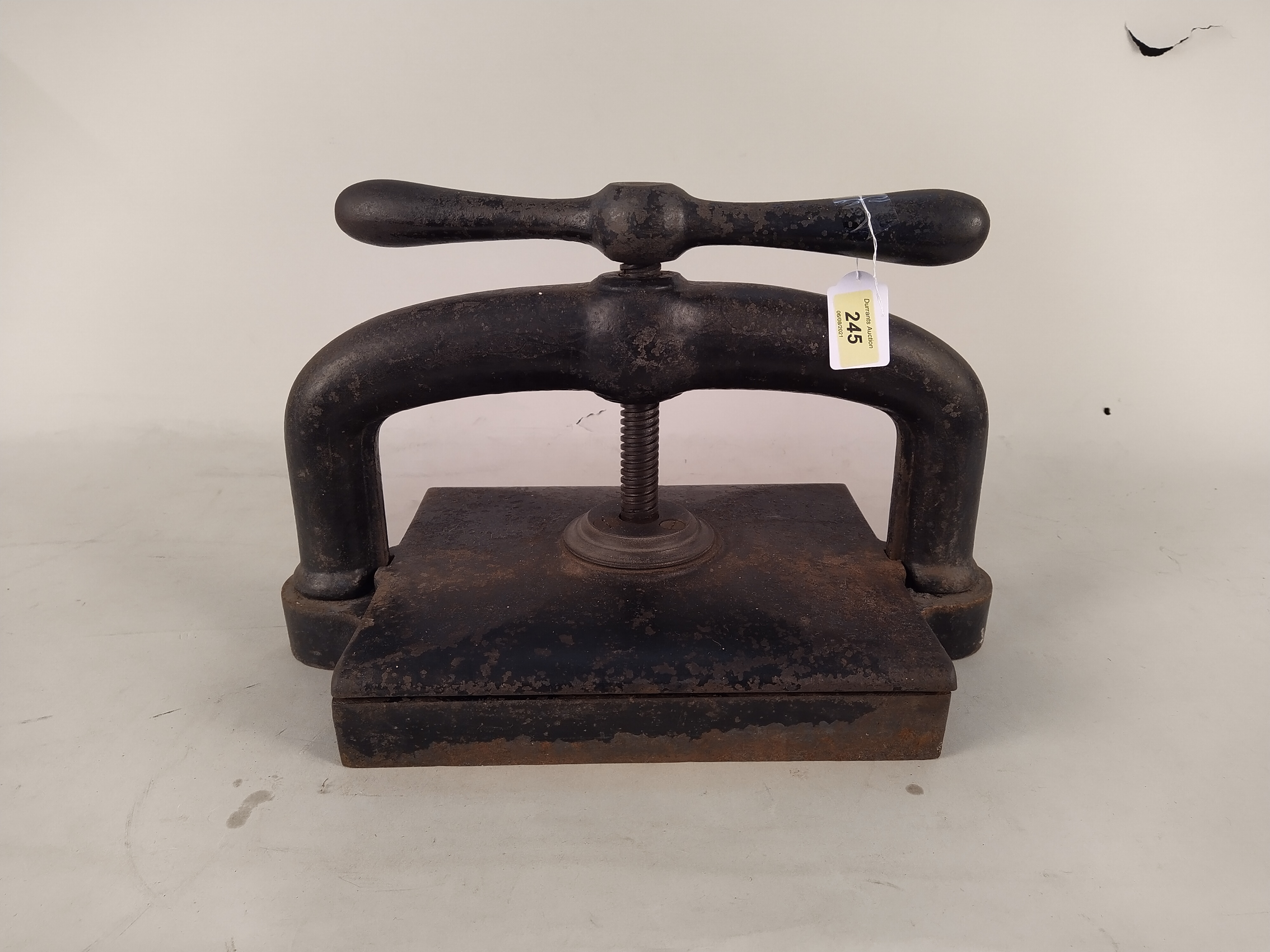 An antique cast iron book press