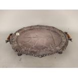 A 19th Century silver plated meat warming dish/tray with wooden handles and ornate feet,