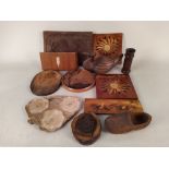 A selection of inlaid and carved wood wares plus two small metal animal door wedges