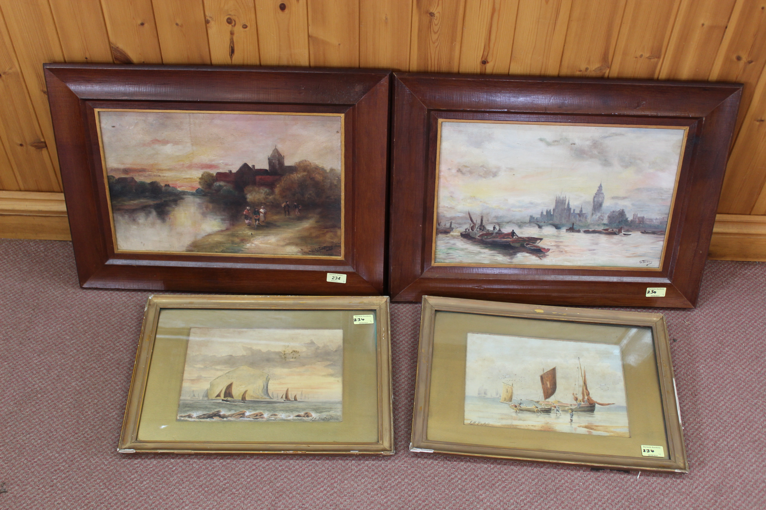 A pair of late 19th Century framed watercolours of coastal scenes with fishing boats signed J H