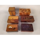 A large selection of inlaid wooden boxes,