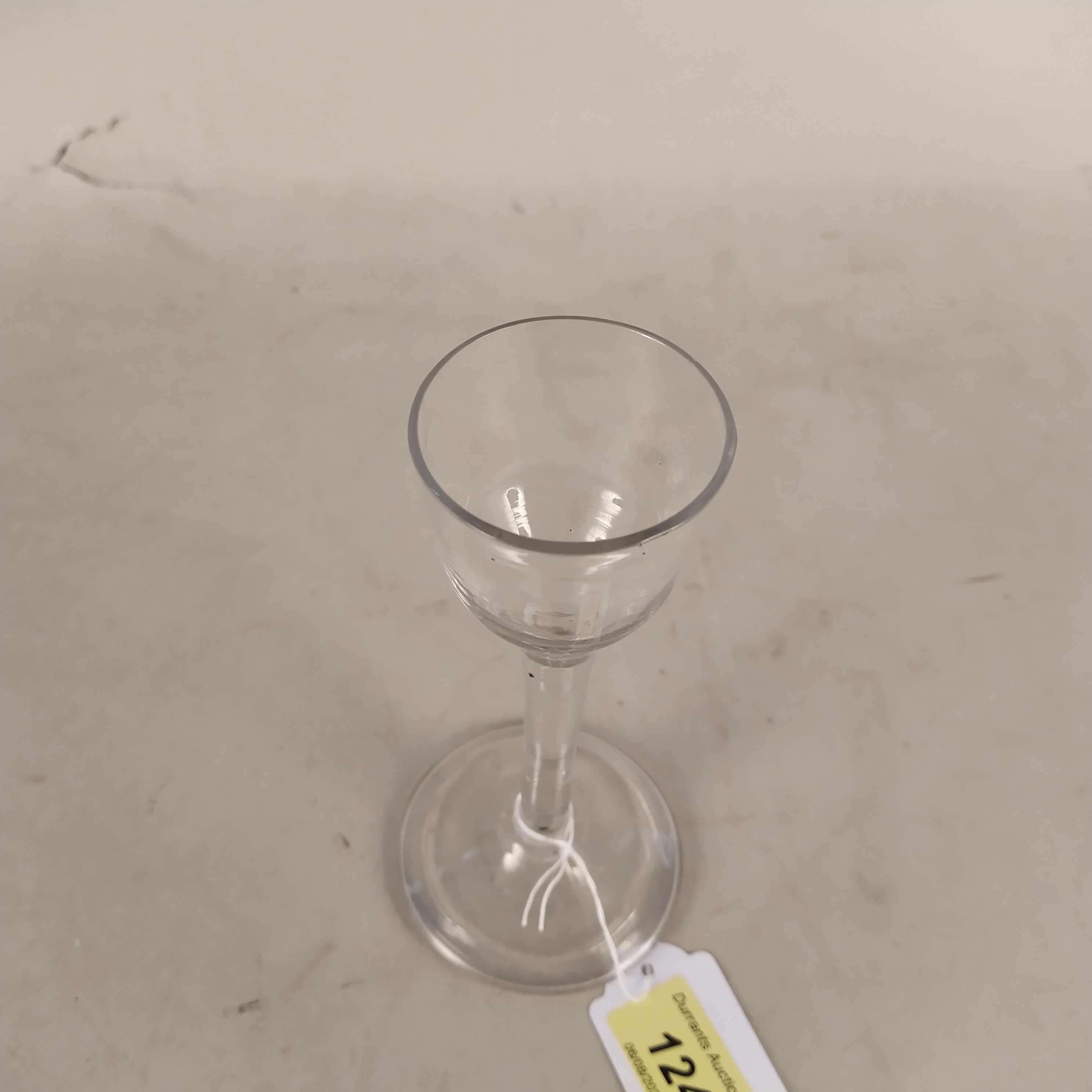 An English cordial glass c1750 with drawn ogee shaped bowl and plain stem with basal knop, - Image 2 of 3