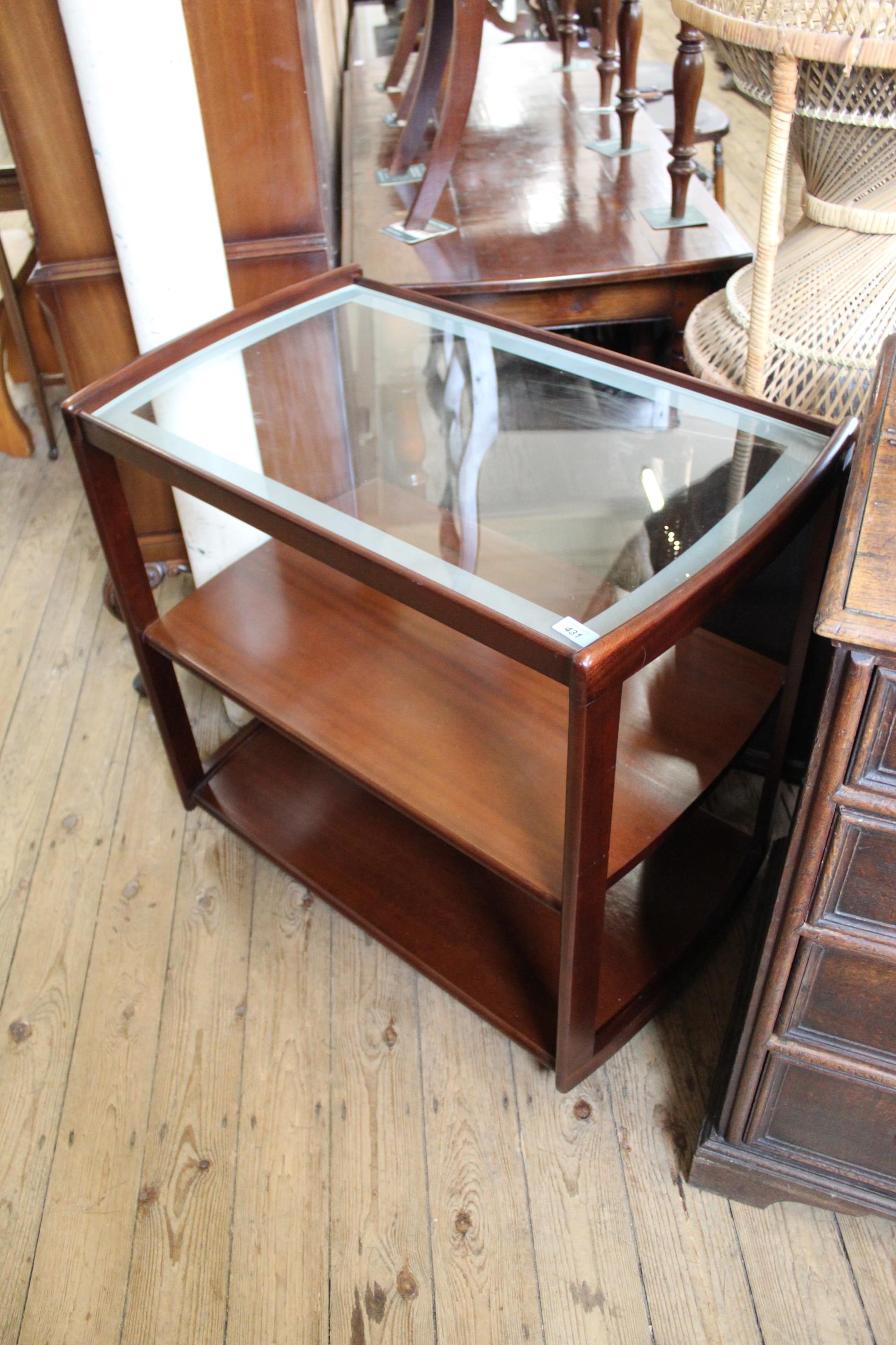 A vintage mahogany frame hostess trolley with glass top