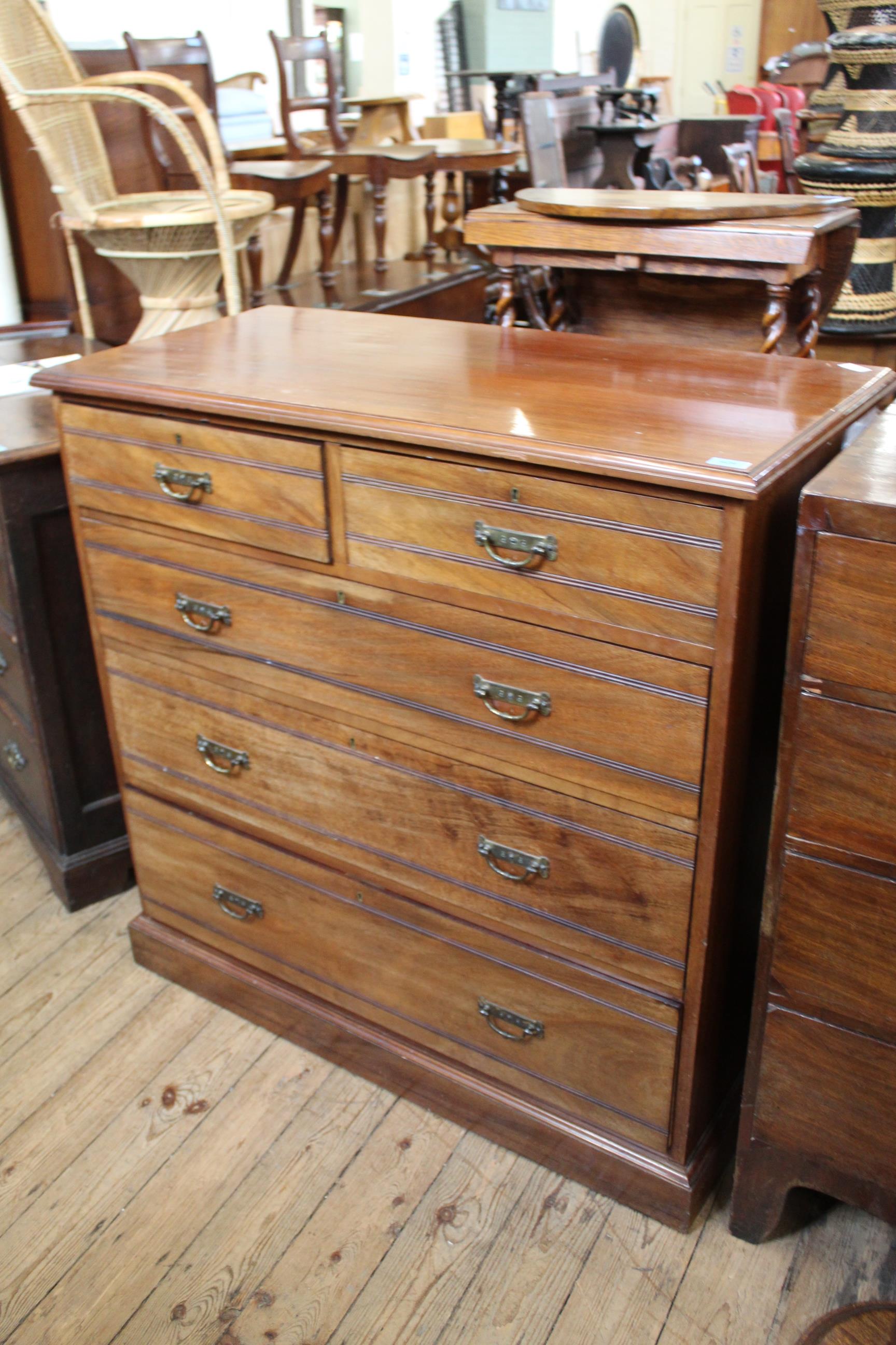 An Edwardian mahogany five drawer chest