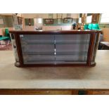 A good quality Edwardian mahogany tulipwood cross banded wall display case with glazed curved ends