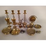 A box of assorted brass items including candlesticks, bowls, vases,