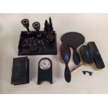 An ebony part dressing table set plus a wooden cased small barometer