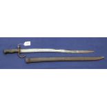 A French model 1866 sabre bayonet dated 1868 with scabbard (a worn example)