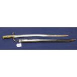 A French model 1866 sabre bayonet with scabbard, blade dated 1871 and maker marked,