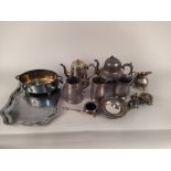 A selection of silver plated teapots etc with a tray and various pewter tankards