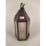 An Arts and Crafts hexagonal coppered brass and glass lantern,