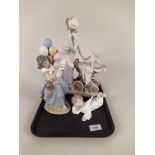 A large Lladro figurine mother with baby in pram 12 1/5" high plus a Lladro girl with balloons and