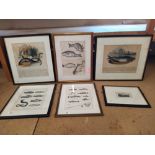 A box of framed prints,