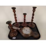 Two pairs of barley twist oak candlesticks with brass sconces,