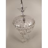 A cut glass hanging ceiling light with facet cut drops