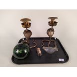 A pair of Indian brass cobra candlesticks,