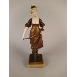 An Art Nouveau French bronze and ivory figurine, signed G Obiols,