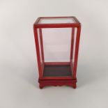 An oriental glazed rosewood table display cabinet