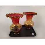 A large pair of hand blown cranberry to amber glass vases,