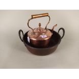 A 19th Century twin handled copper preserving pan plus a Victorian circular seamed copper kettle