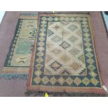 Two kilims in earthy tones with geometric medallions