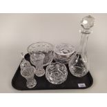 A cut glass lidded bowl and cover plus two cut glass bowls and decanter,
