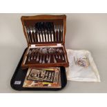 A cased canteen of silver plated cutlery plus a selection of vintage recipe books