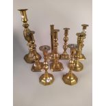 Various vintage brass and metal candlesticks,