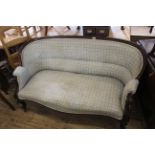 A Victorian rosewood upholstered sofa