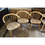 A set of three mid Century Ercol blonde teak kitchen armchairs