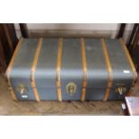 A vintage bentwood steamer trunk