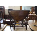 A late 19th Century oak barley twist gate leg table