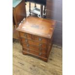 A yew chest of four drawers in Regency style