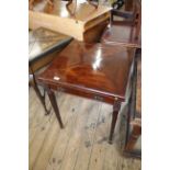 An Edwardian mahogany envelope folding card table