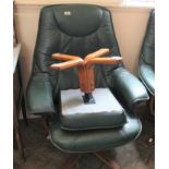 A green leather Stressless style reclining armchair with matching foot stool