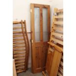 A pair of integral pine glazed doors