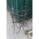 Three metal pot stands