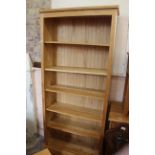 A large modern pine adjustable bookcase